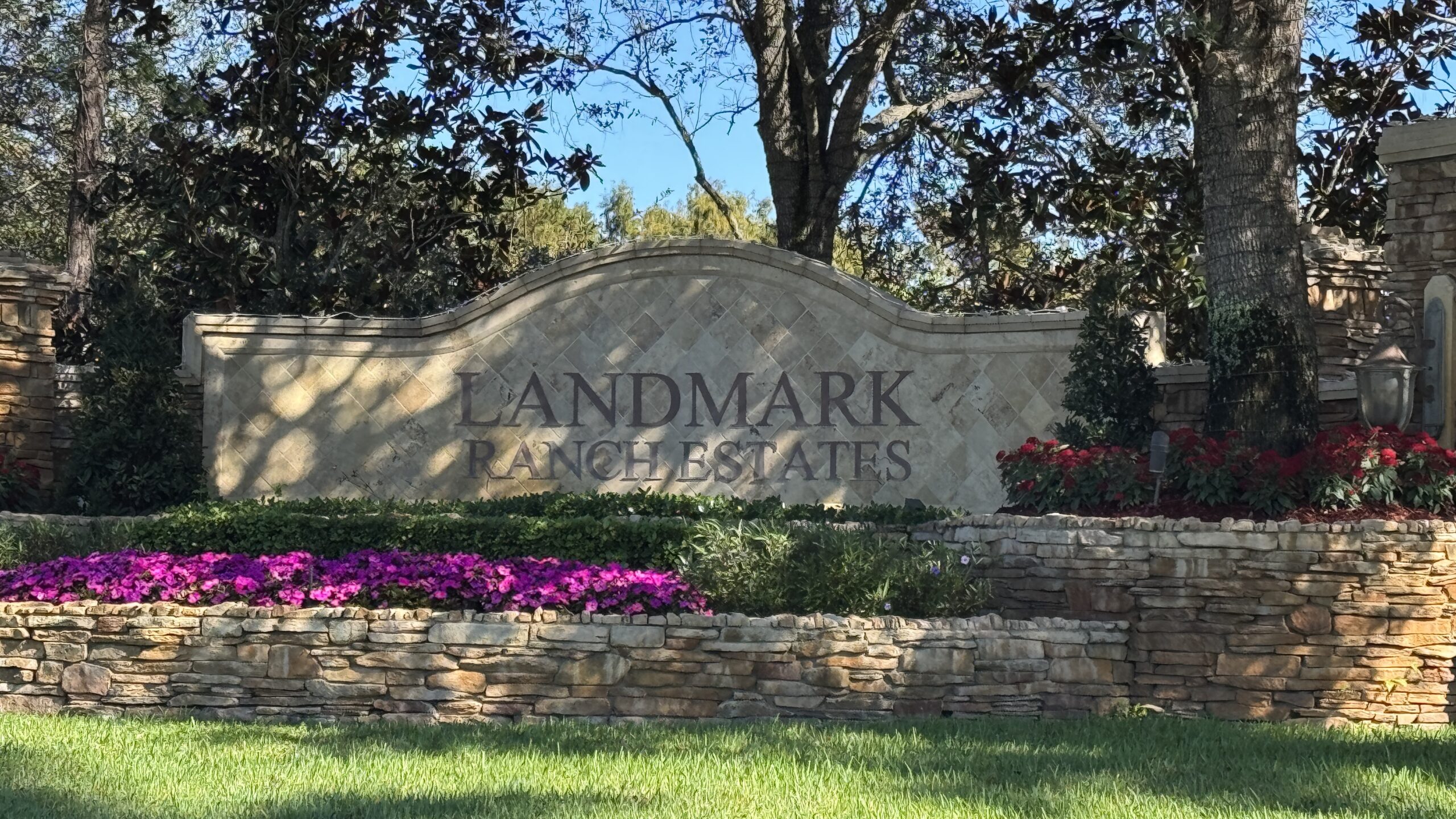 a neighborhood sign that says Landmark Ranch Estates