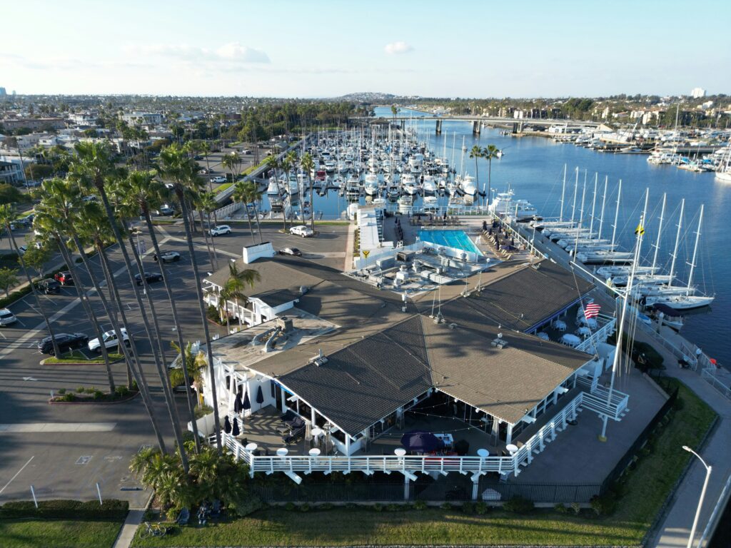an aerial view of a marina with many boats